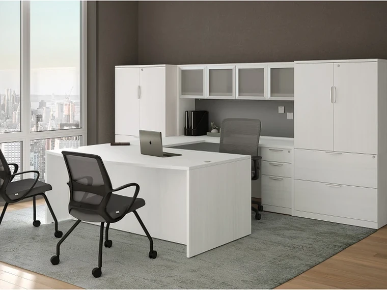 L-Desk with Hutch – White L-shaped desk with overhead storage.