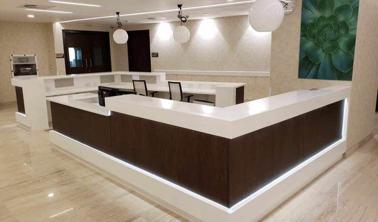 Custom Reception Counter – Long counter with a lit base.